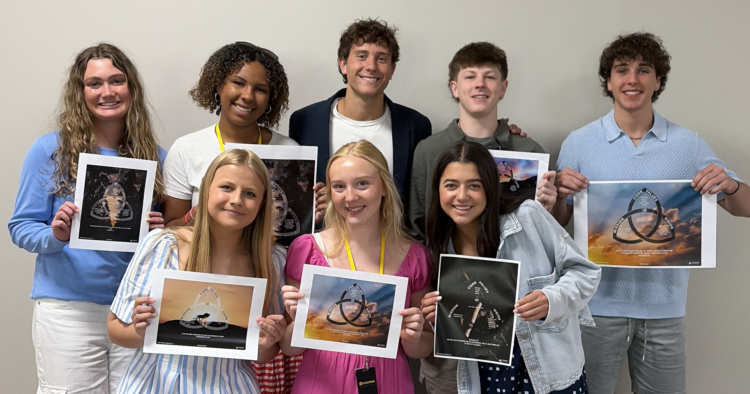 Students holding their completed Mission Portrait™s
